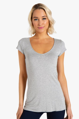 Model is wearing a heather grey short sleeve tunic Virginia by Chloe Colette.