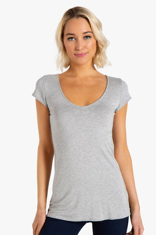 Model is wearing a heather grey short sleeve tunic Virginia by Chloe Colette.