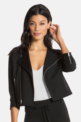 Model wearing a women moto jacket in black. Front View