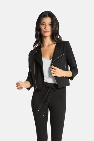 Model wearing a women moto jacket in black.