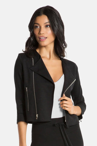 Model wearing a women moto jacket in black. Front View