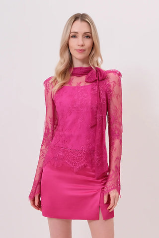 The Model is wearing a hibiscus color Maddona lace top