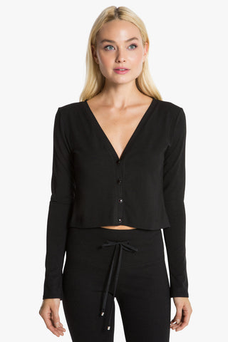 Model wearing a black outfit for Wholesale Collection image.