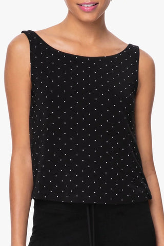 Model is wearing a pindot Cecilia Boat neck tank top by Chloe Colette.