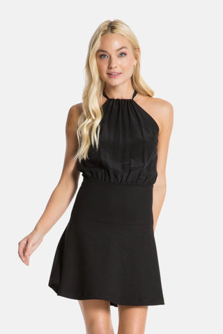 Model wearing a black Stephanie mini dress by Chloe Colette