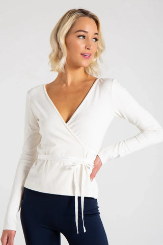Image for variant collection of the Sydney Cardigan Wrap. Model wearing an ivory cardigan wrap.