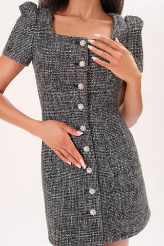 Close up image of  model wearing a grey Amelie Tweed Dress by Chloe Colette.