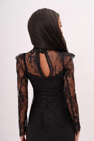 The model is wearing a black noir Madonna Lace Top by Chloe Colette.