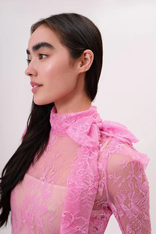 The model is wearing a pink rose Madonna lace Top by Chloe Colette.