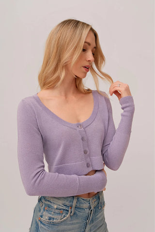 The model is wearing a amethyst Glitz Cardi top by Chloe Colette showing the front side.
