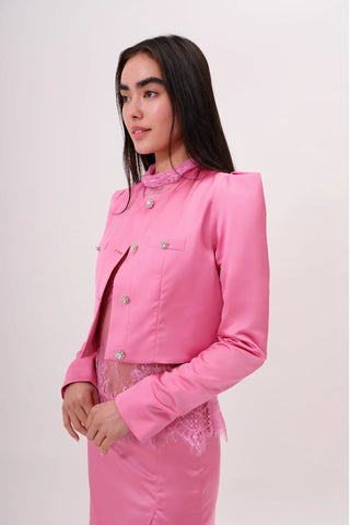 The model is wearing a juliette satin jacket in pink pearl and Jenny Mini Skirt by Chloe Colette 