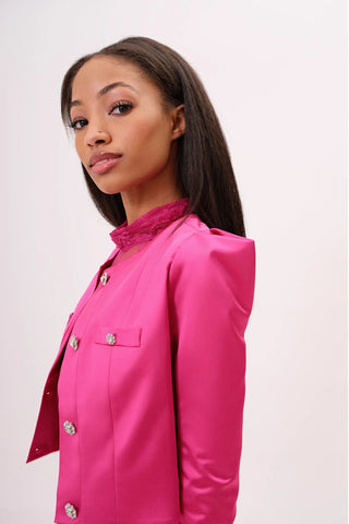 The model is wearing a Juliette Satin Jacket in rosalite Skirt by Chloe Colette.