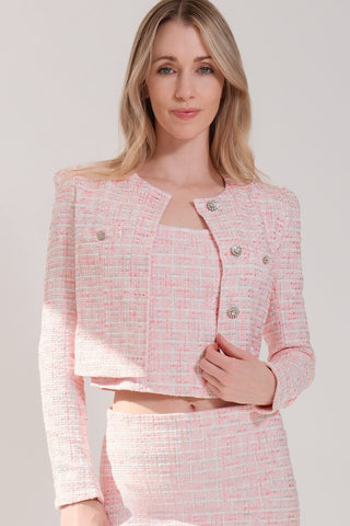 The model is wearing a pink rose Juliette Tweed Jacket and Jenny Tweed Mini Skirt by Chloe Colette.