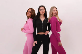 Group shot of three models of Malibu Zip Up and Pants in Candy Pink, Black and Fuchsia by Chloe Colette.