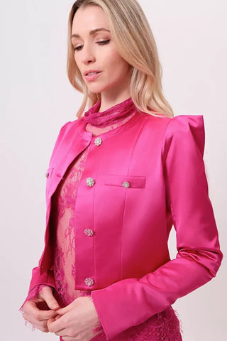 The model is wearing a satin rosolite Juliette jacket by Chloe colette