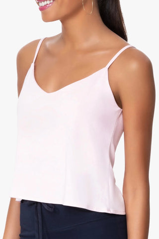 Model is wearing a pink Cassi vneck cami by Chloe Colette.