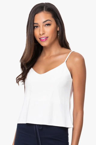 Model is wearing a white Cassi v neck cami by Chloe Colette.
