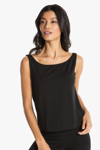 Model is wearing a black boat neck tank top Cecilia by Chloe Colette