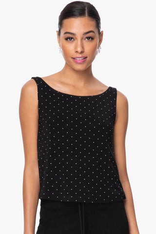 Model is wearing a pindot boat neck tank top Cecilia by Chloe Colette