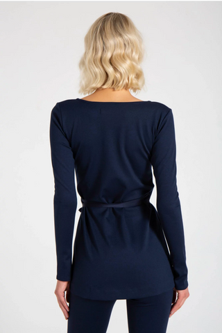 Model is wearing a navy Clair Wrap Tunic by Chloe Colette.