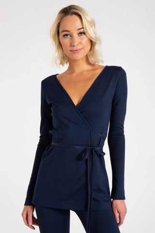 Model is wearing a navy Clair Wrap Tunic by Chloe Colette.
