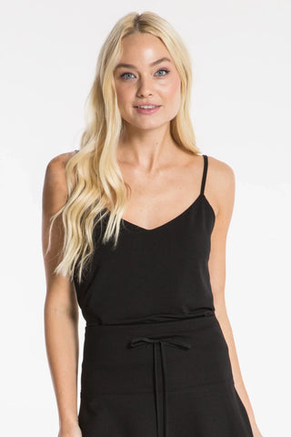 Model wearing a black silk strappy cami v-neck Jennifer by Chloe Colette.