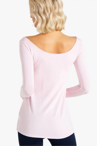 Model is wearing ballet pink Marina boat neck tunic by Chloe Colette.