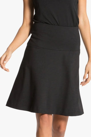 Model is wearing a black Maxine regular skirt by Chloe Colette.
