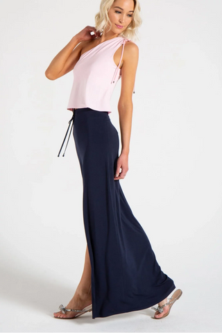 Model is wearing a navy Miami maxi skirt by Chloe Colette.