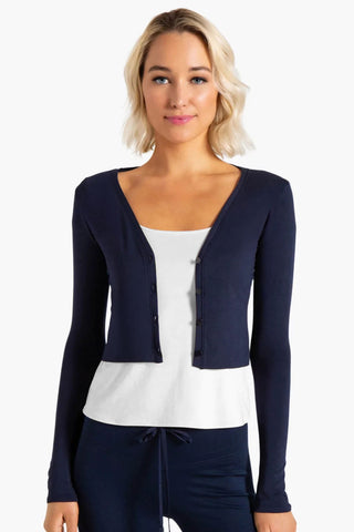 Model is wearing a navy Natasha cardigan by Chloe Colette.