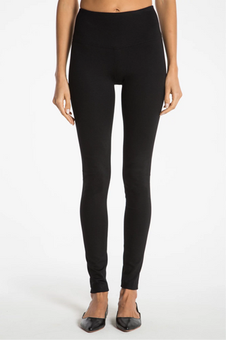 Model is wearing a black New York long leggings by Chloe Colette.