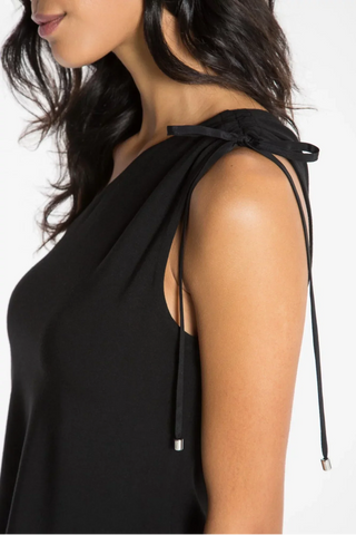 Model is wearing a black Julie on shoulder top by Chloe Colette.