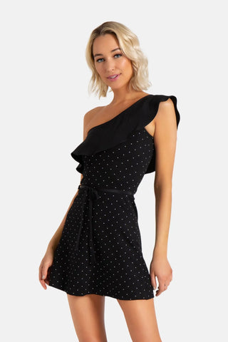 Model is wearing a pindot Paris one shoulder dress by Chloe Colette.