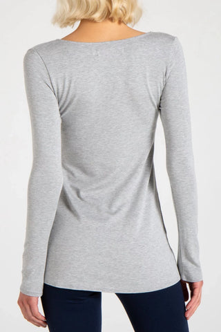 Model is wearing a heather grey Sonja long sleeve tunic tee by Chloe Colette.