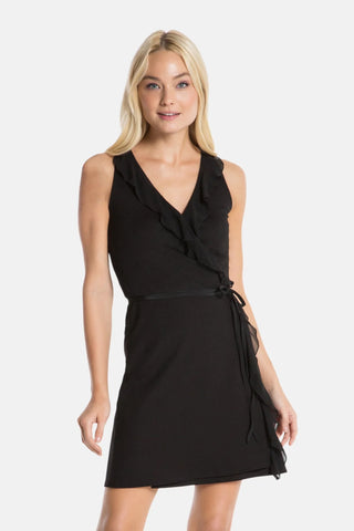 Model is wearing a black Bliss wrap dress by Chloe Colette.