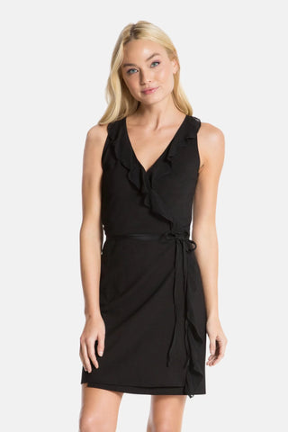 Model is wearing a black Bliss wrap dress by Chloe Colette.