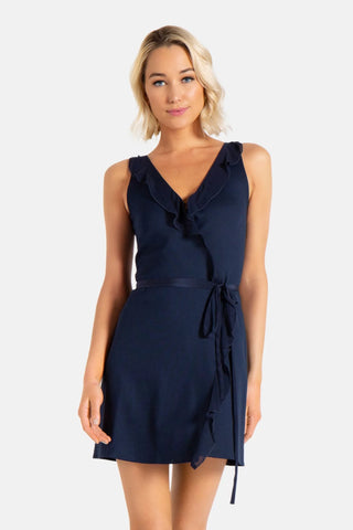 Model is wearing a navy Bliss wrap mini dress by Chloe Colette.