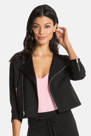 Model is wearing a black women's moto jacket Laura by Chloe Colette.