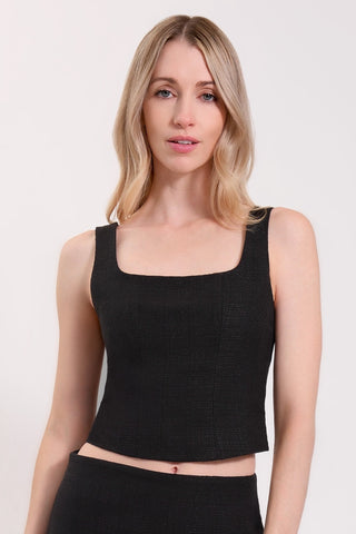 The model is wearing noir/black square neck tank tweed top by Chloe Colette.