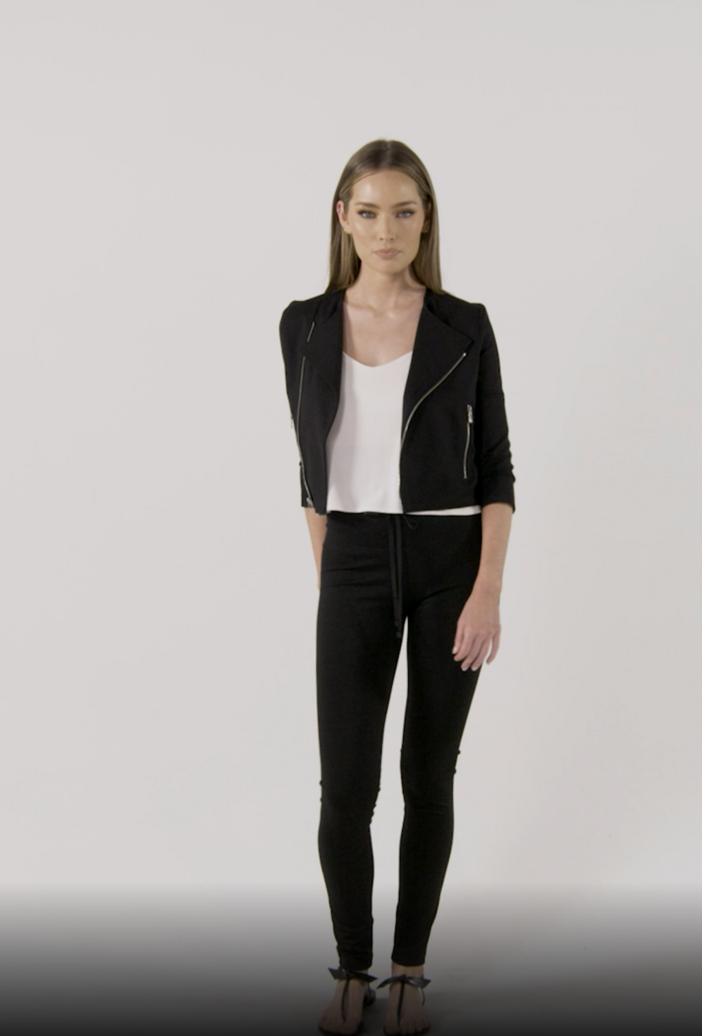 Model is wearing a black moto jacket Laura by Chloe Colette.